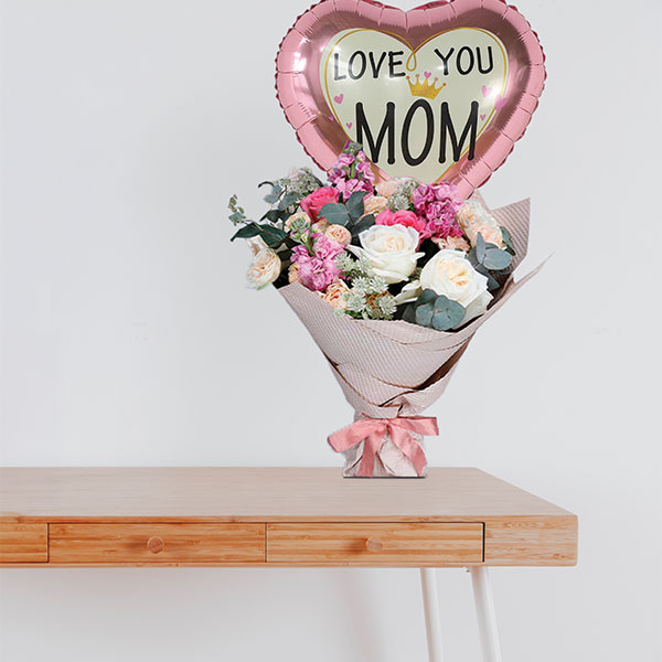 Hues of Nature bouquet with pastel roses and "Love You Mom" balloon – send flowers to Lebanon